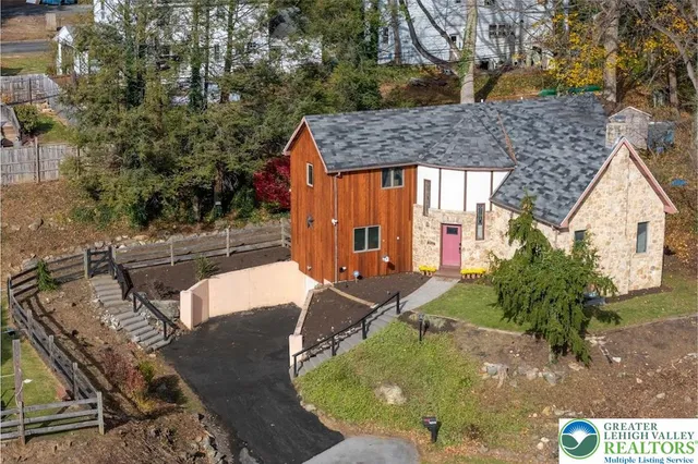 an aerial view of a house with swimming pool