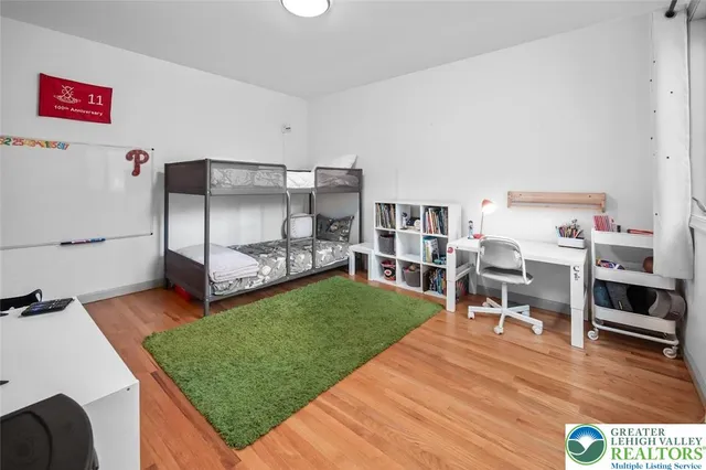 a living room with furniture and a dining table