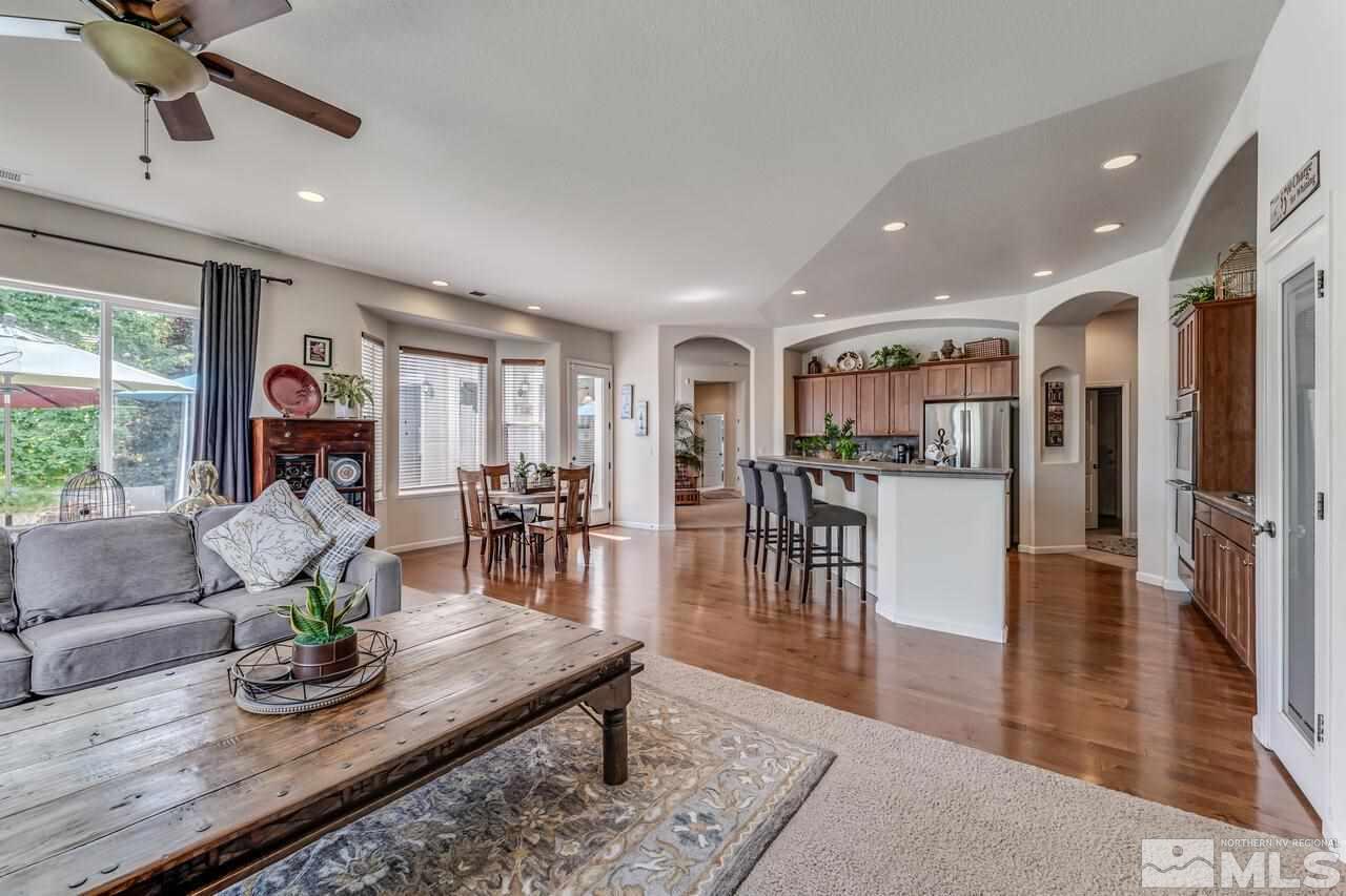 1635 Gulch Way Reno, NV 89521 - Photo 9 of 39 a living room with furniture wooden floor and a table