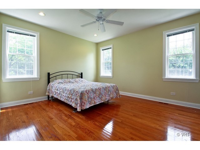 438 Briarhill Road Glenview, IL 60025 - Photo 8 of 17 a bedroom with a bed and window