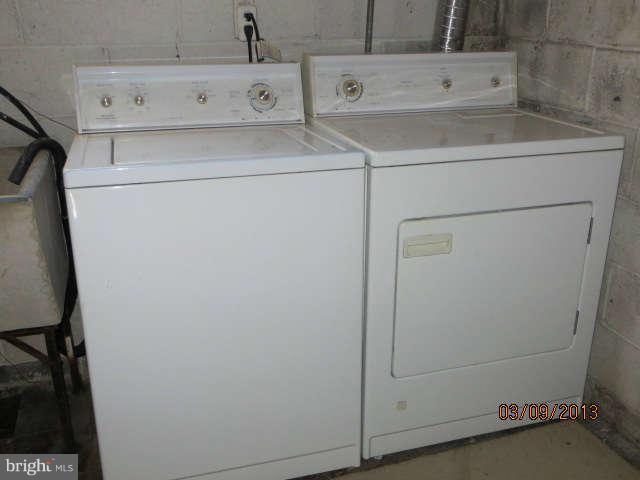 408 Crosby Road Baltimore, MD 21228 - Photo 12 of 17 a utility room with dryer and washer