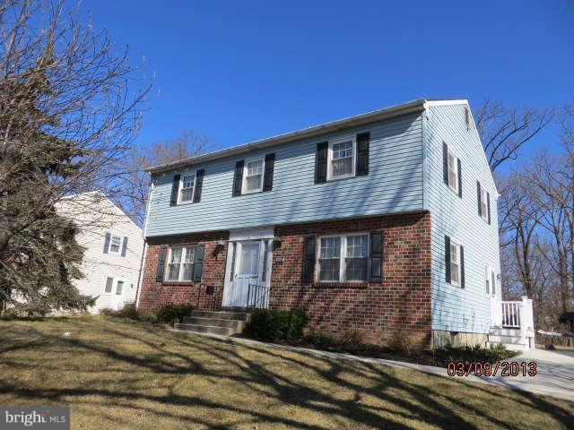 408 Crosby Road Baltimore, MD 21228 - Photo 13 of 17 a front view of a house with a yard