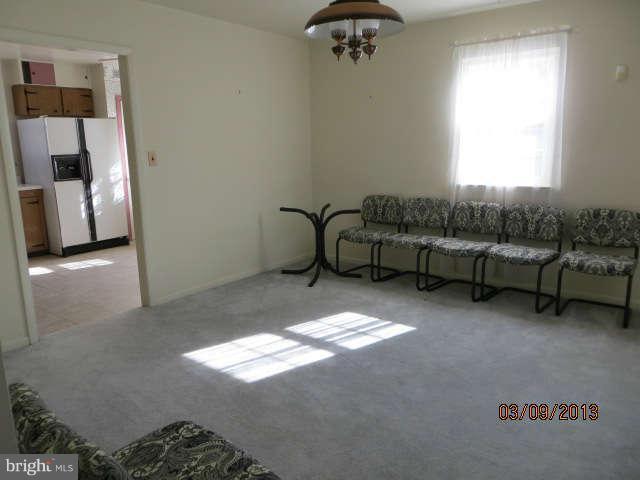 408 Crosby Road Baltimore, MD 21228 - Photo 3 of 17 a living room with furniture and a window