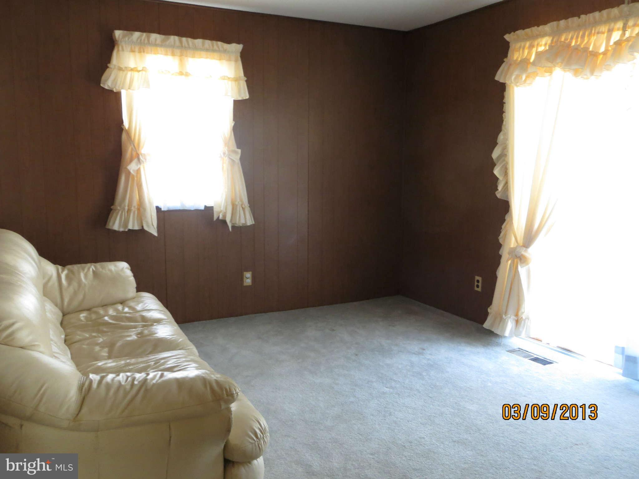 408 Crosby Road Baltimore, MD 21228 - Photo 5 of 17 a living room with furniture and a window