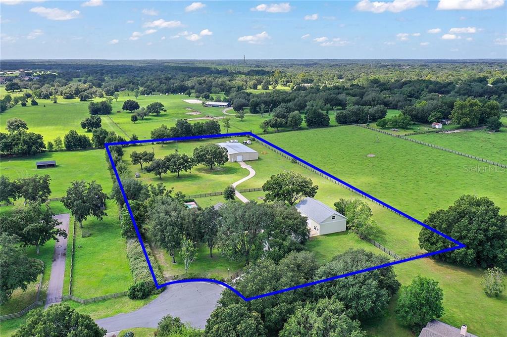 Stunning country horse estate with mature Oaks grace this fully fenced 5 acre parcel complete with 2 wells and 2 septic systems.
