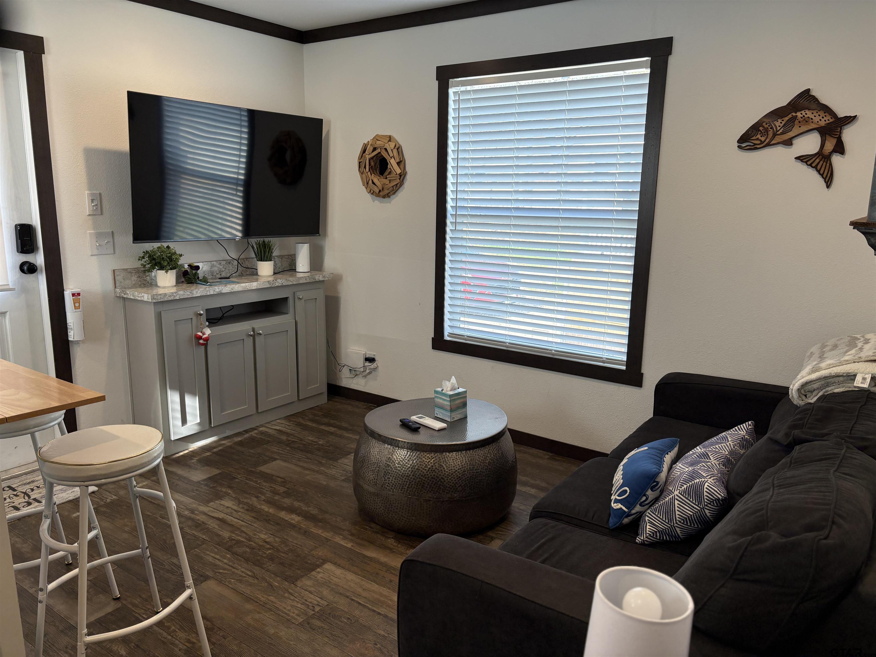 a living room with furniture and a flat screen tv