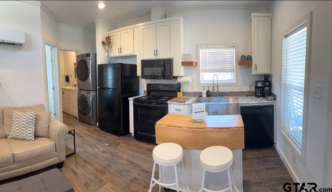 281 Indian Gap Quitman, TX 75783 - Photo 5 of 30 a kitchen with stainless steel appliances granite countertop a refrigerator a sink a stove a dining table and chairs