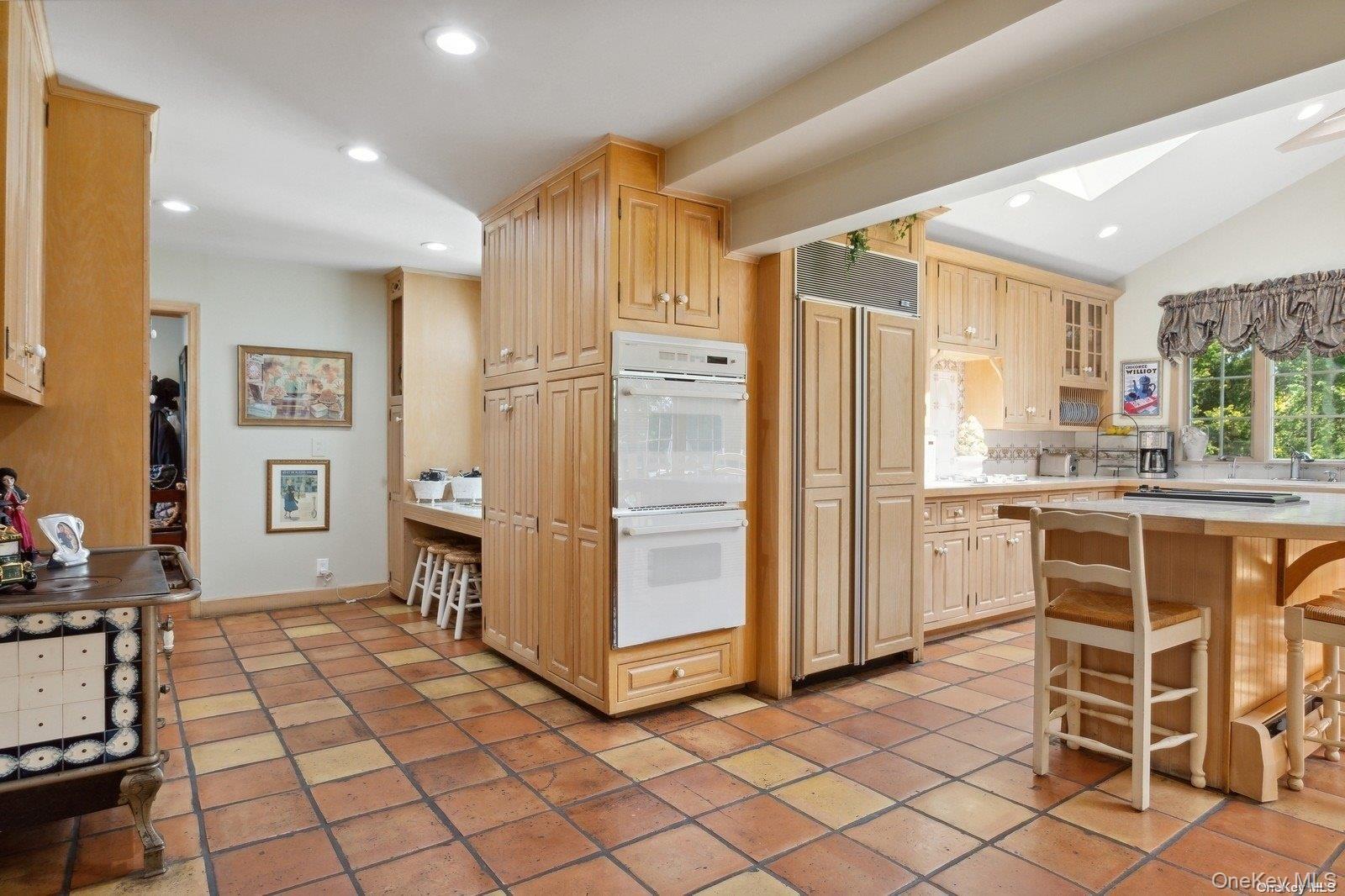 1345 Harbor Road Hewlett, NY 11557 - Photo 17 of 36 a kitchen with granite countertop cabinets and refrigerator