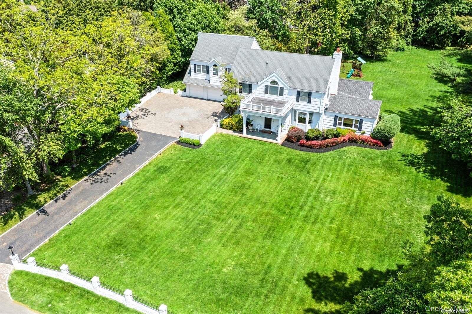1345 Harbor Road Hewlett, NY 11557 - Photo 29 of 36 an aerial view of residential houses with outdoor space and trees