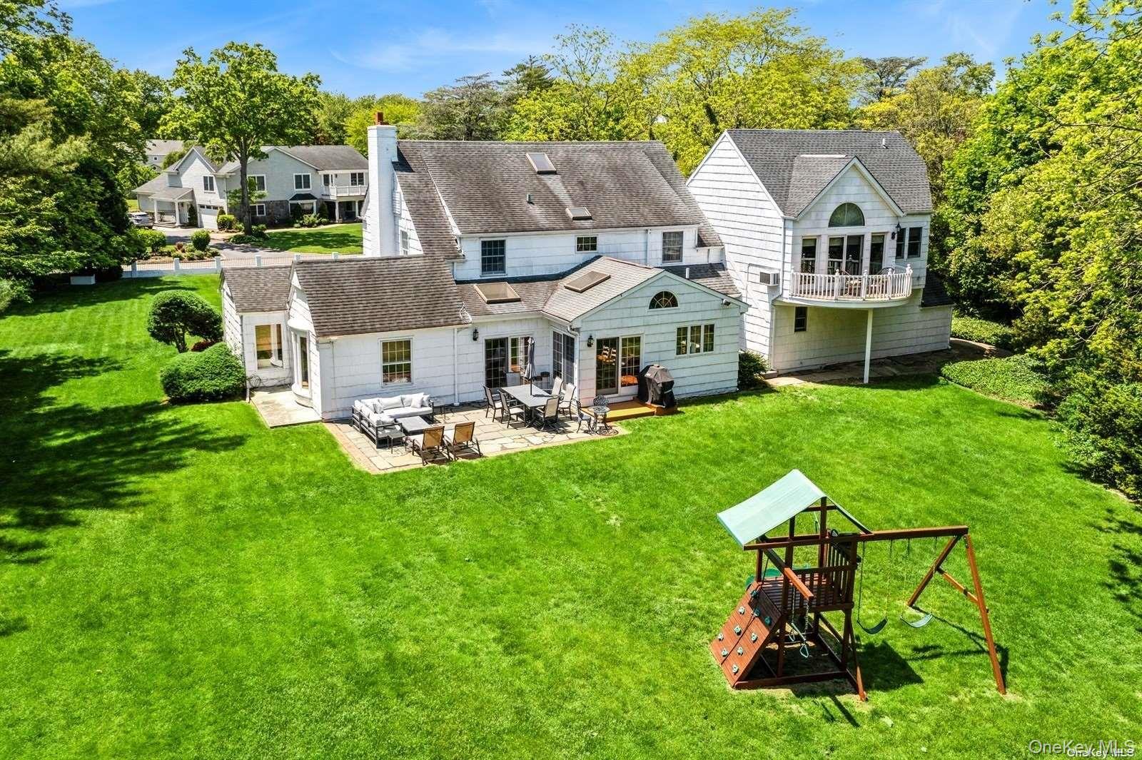 1345 Harbor Road Hewlett, NY 11557 - Photo 31 of 36 a view of a patio with table and chairs and potted plants
