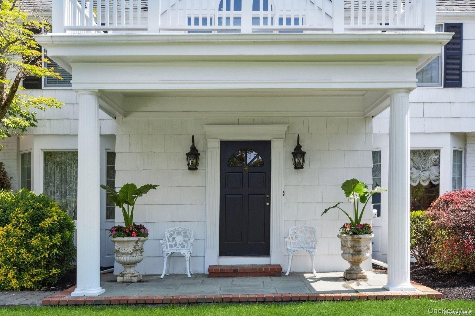 1345 Harbor Road Hewlett, NY 11557 - Photo 4 of 36 a front view of a house with a swimming pool