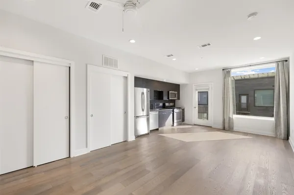 a kitchen with stainless steel appliances wooden cabinets and a stove top oven