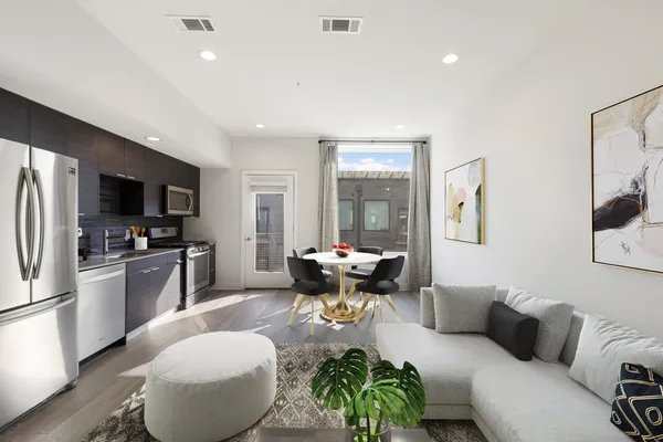 a living room with fireplace furniture and a flat screen tv