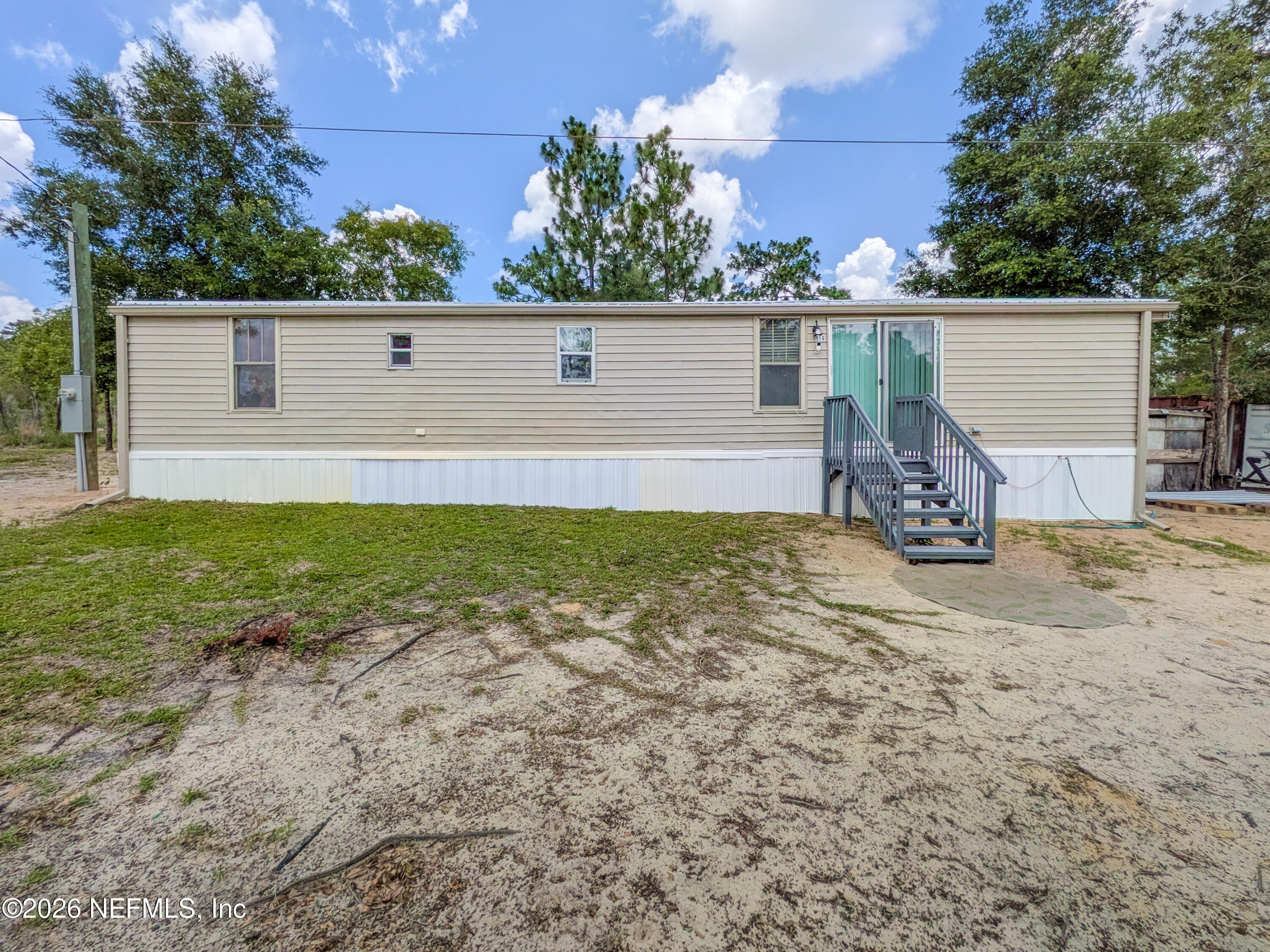 116 London Avenue Interlachen, FL 32148 - Photo 22 of 25 front view of a house with a yard