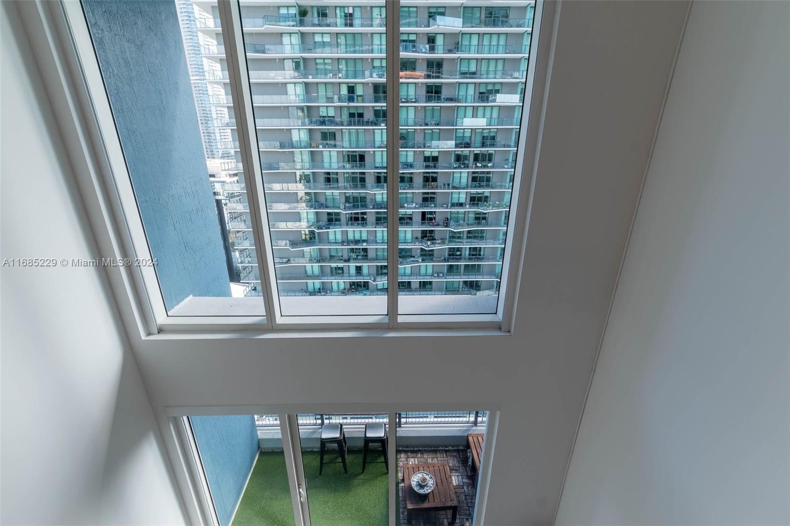60 Southwest 13th Street, Unit 2618 Miami, FL 33130 - Photo 19 of 24 a balcony with a sink and a window