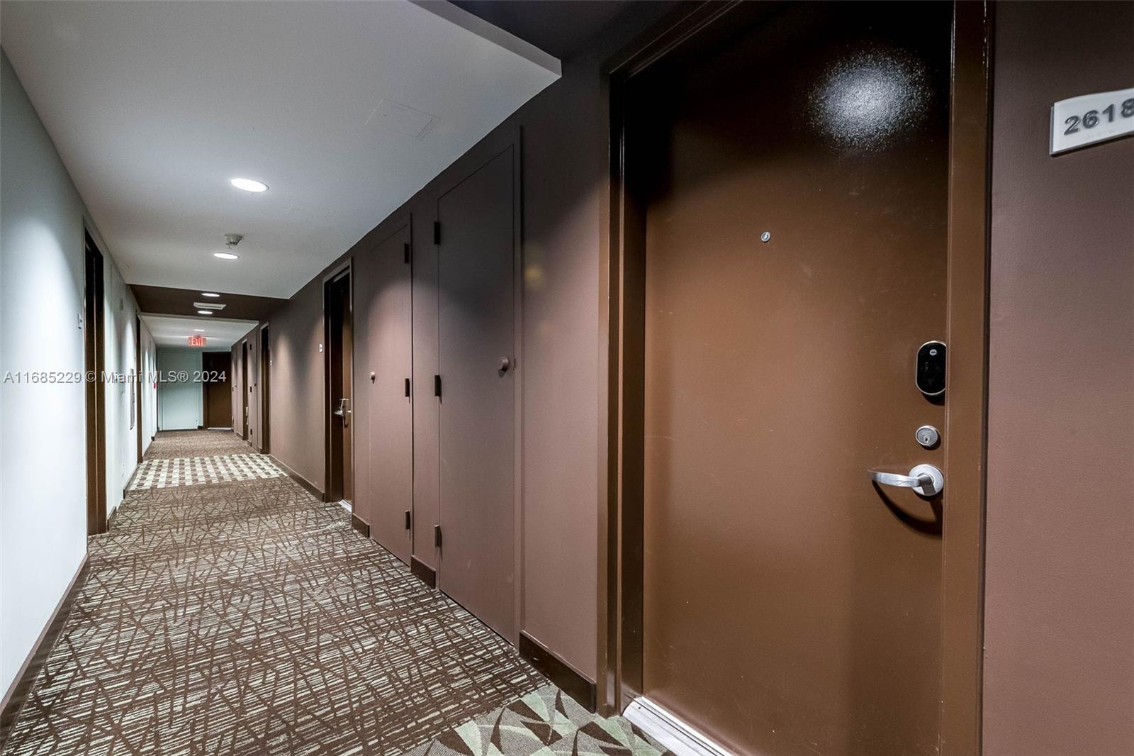 60 Southwest 13th Street, Unit 2618 Miami, FL 33130 - Photo 20 of 24 wooden floor in a hall with a rug