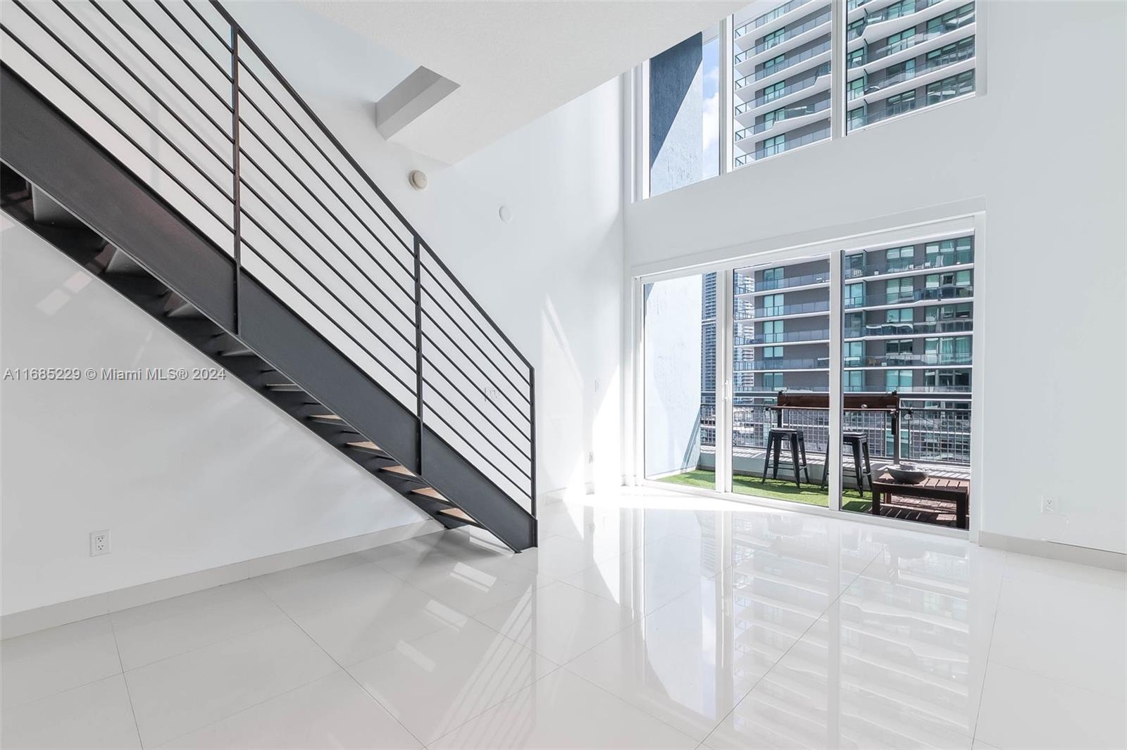 60 Southwest 13th Street, Unit 2618 Miami, FL 33130 - Photo 5 of 24 wooden floor view with staircase