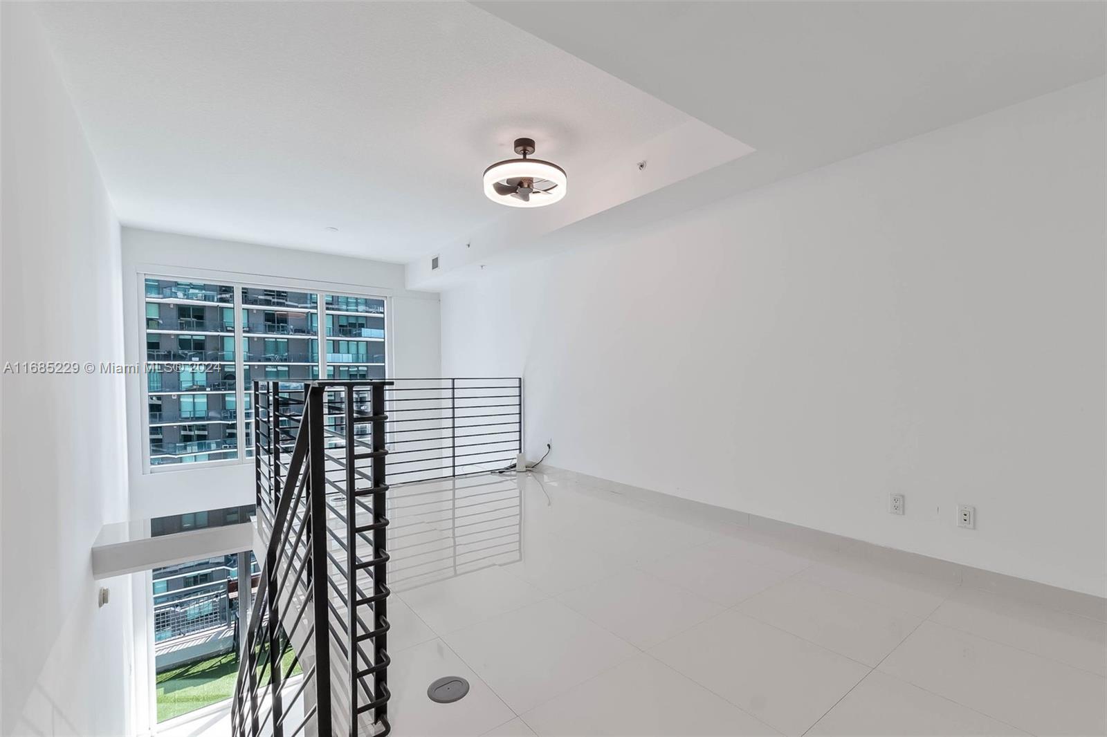 60 Southwest 13th Street, Unit 2618 Miami, FL 33130 - Photo 9 of 24 an empty room with windows