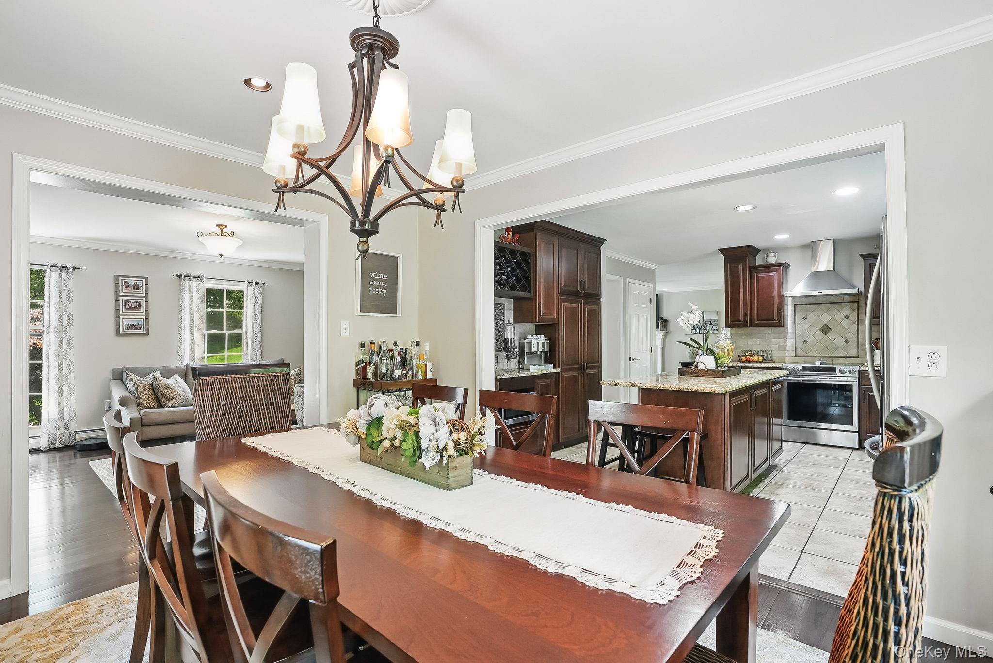 304 Church Road Putnam Valley, NY 10579 - Photo 11 of 50 Dining space featuring a chandelier, crown molding, light wood-style floors, and recessed lighting