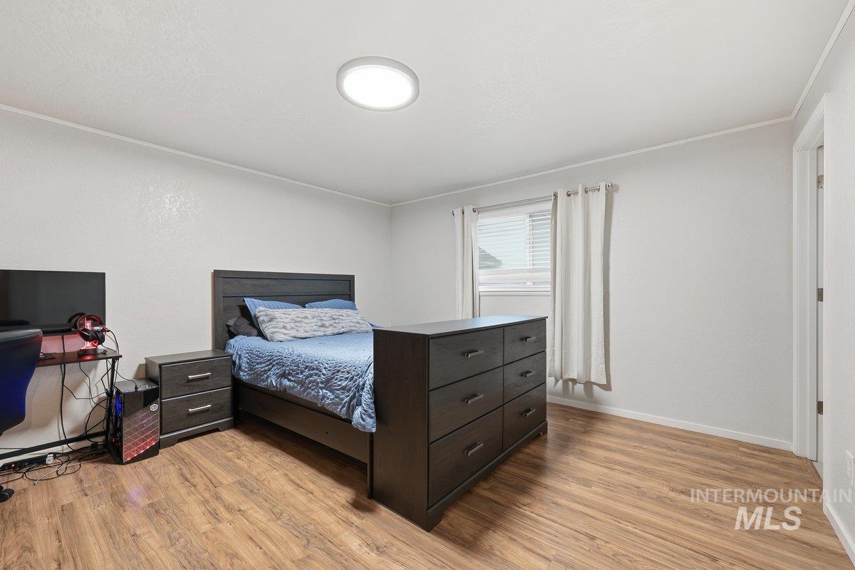 2920 South 10th Avenue Caldwell, ID 83605 - Photo 14 of 21 Bedroom with light wood finished floors and baseboards