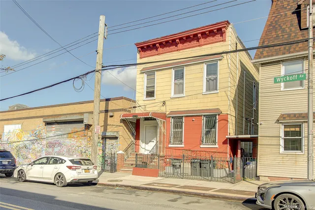 a cars parked in front of a building
