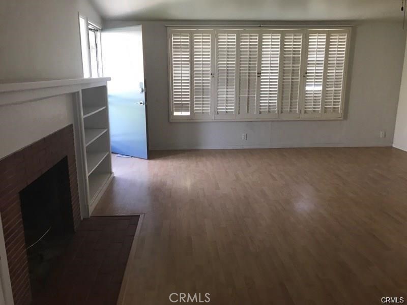 110 Ruby Drive Placentia, CA 92870 - Photo 2 of 9 an empty room with wooden floor and windows