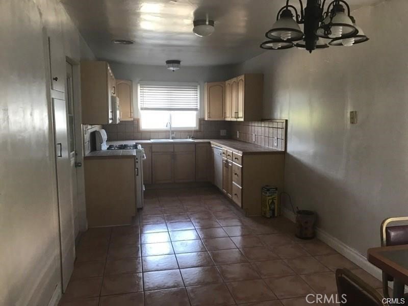 110 Ruby Drive Placentia, CA 92870 - Photo 7 of 9 a kitchen with stainless steel appliances granite countertop a sink a stove and a refrigerator
