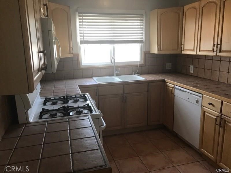 110 Ruby Drive Placentia, CA 92870 - Photo 8 of 9 a kitchen with a stove a sink and a window