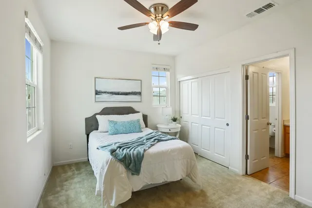 a bedroom with a bed and a dresser