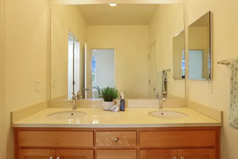 a bath room with a toilet and a bath tub