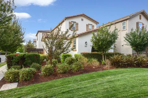 a front view of house with garden