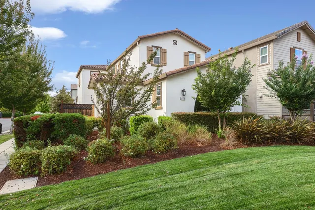 a front view of house with garden