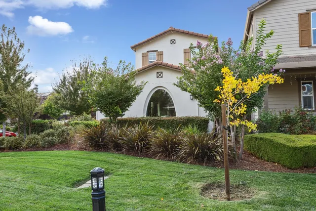 a front view of a house with garden