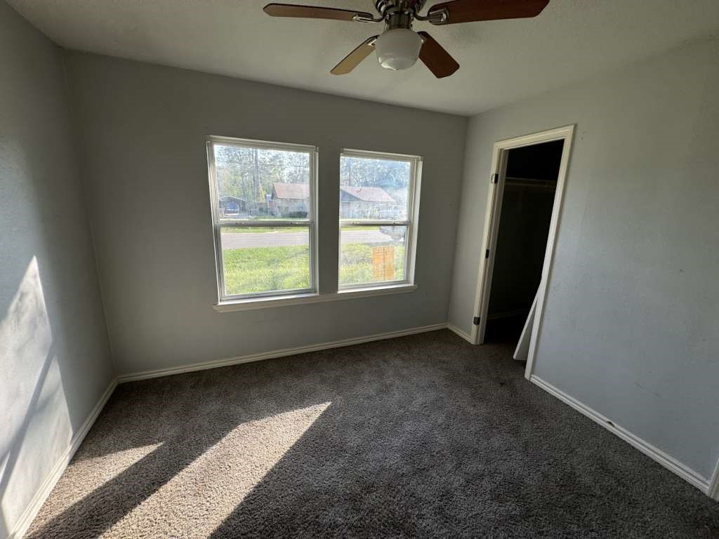 1301 Truman Street Cleveland, TX 77327 - Photo 11 of 11 a view of an empty room with a window