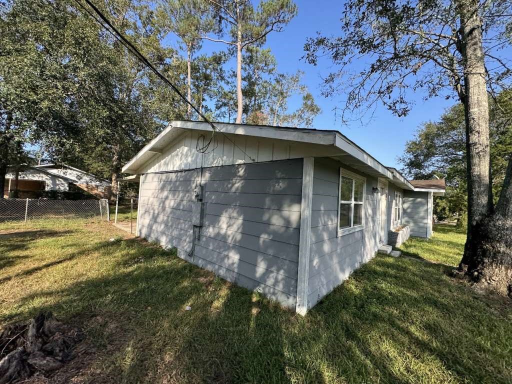 1301 Truman Street Cleveland, TX 77327 - Photo 2 of 11 a backyard of a house with lots of green space