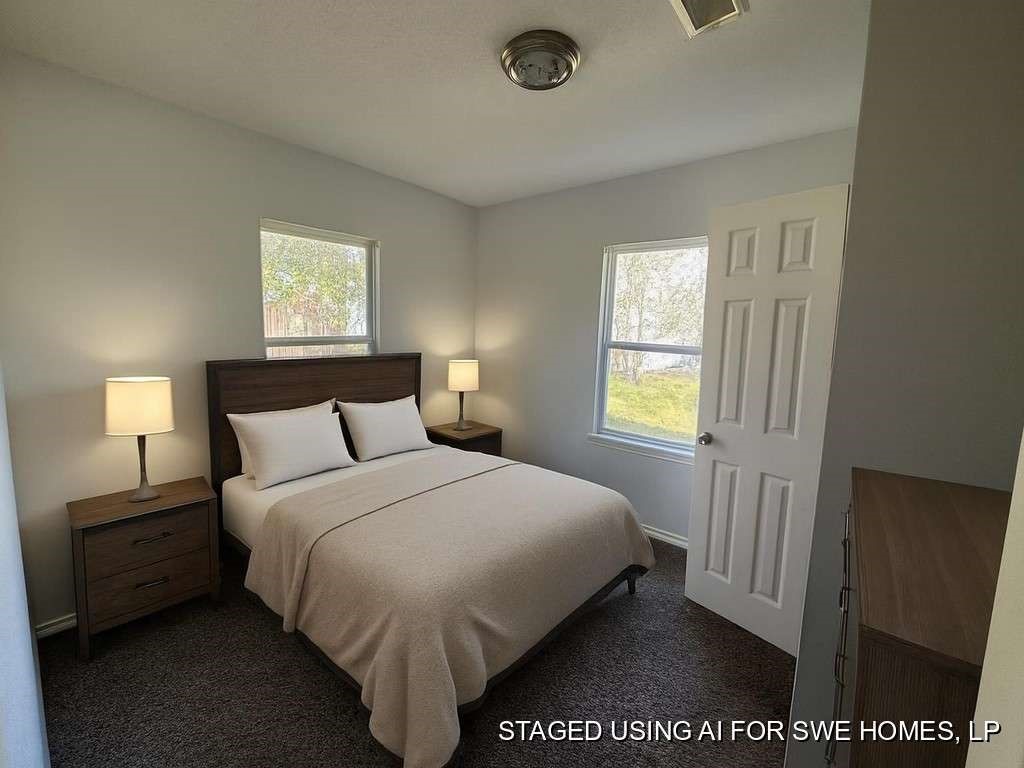 1301 Truman Street Cleveland, TX 77327 - Photo 9 of 11 a bedroom with a bed and a window