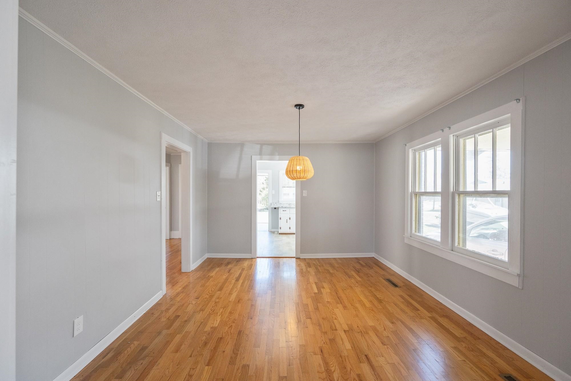 1175-1213 Perryville Road Parsons, TN 38363 - Photo 11 of 32 a view of an empty room with wooden floor and a window