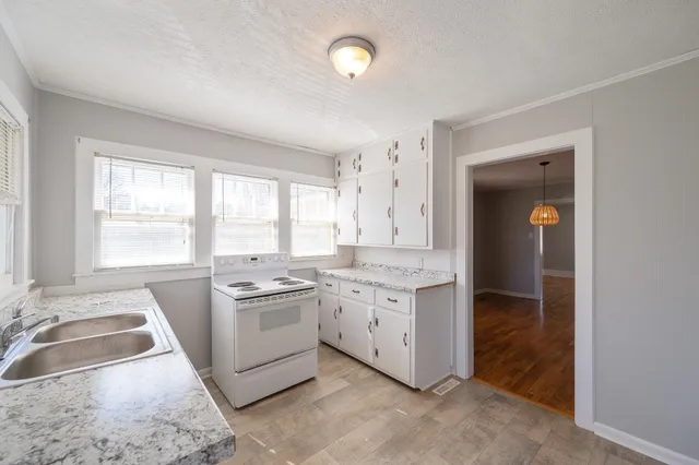 a room with sink washer and dryer