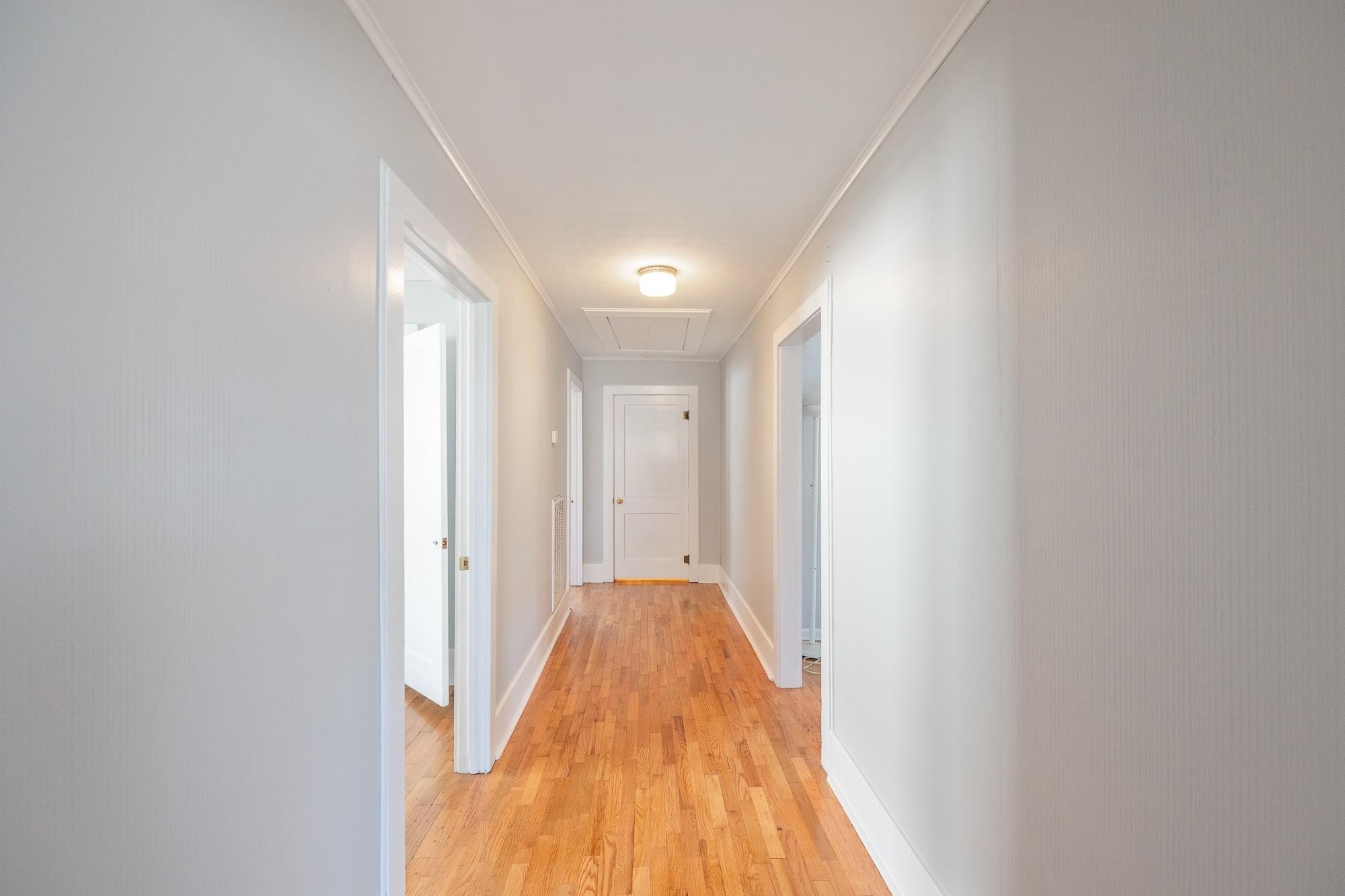 1175-1213 Perryville Road Parsons, TN 38363 - Photo 19 of 32 a view of a hallway with wooden floor