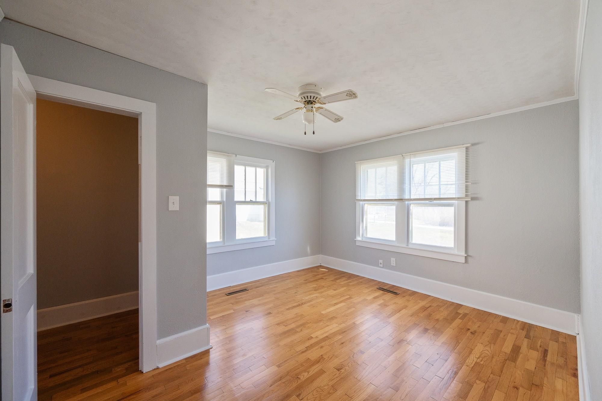 1175-1213 Perryville Road Parsons, TN 38363 - Photo 23 of 32 a view of an empty room with a window and wooden floor