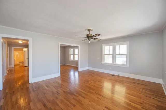 a dining room with wooden floor and breakfast area