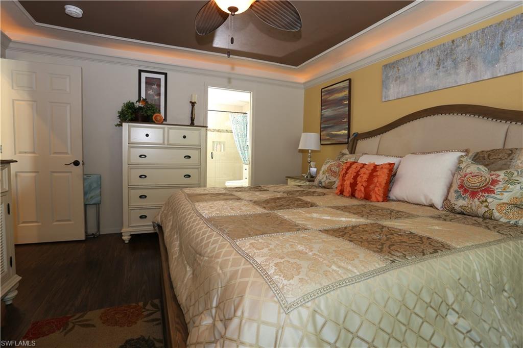 3563 Antarctic Circle, Unit 2102 Naples, FL 34112 - Photo 15 of 26 a bedroom with a bed and a window