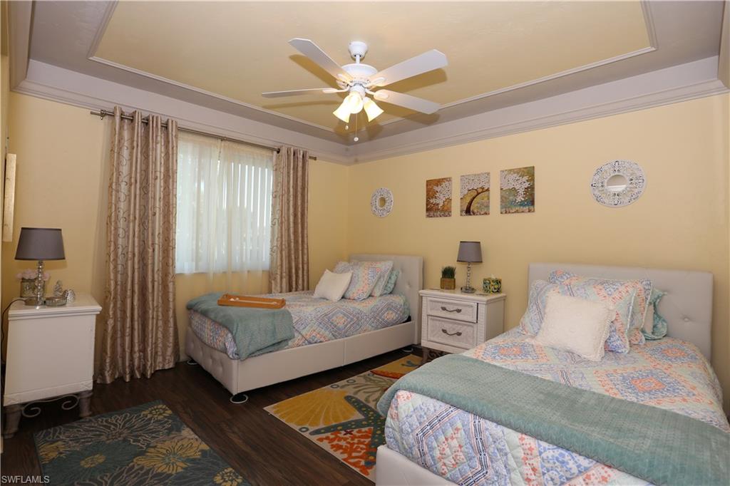 3563 Antarctic Circle, Unit 2102 Naples, FL 34112 - Photo 19 of 26 a bedroom with two beds and window
