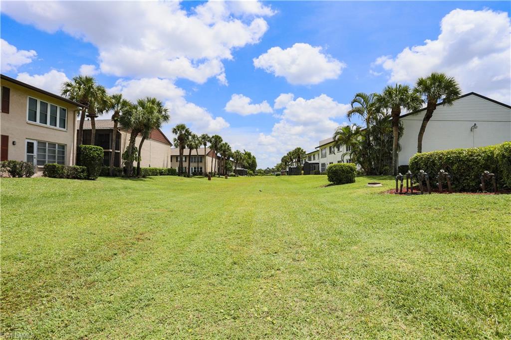 3563 Antarctic Circle, Unit 2102 Naples, FL 34112 - Photo 22 of 26 a view of a tree in front of a house