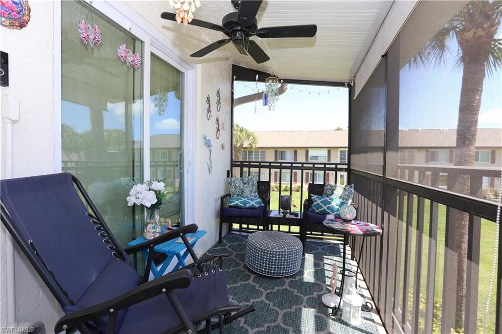 3563 Antarctic Circle, Unit 2102 Naples, FL 34112 - Photo 4 of 26 a dining room with furniture water view and a floor to ceiling window