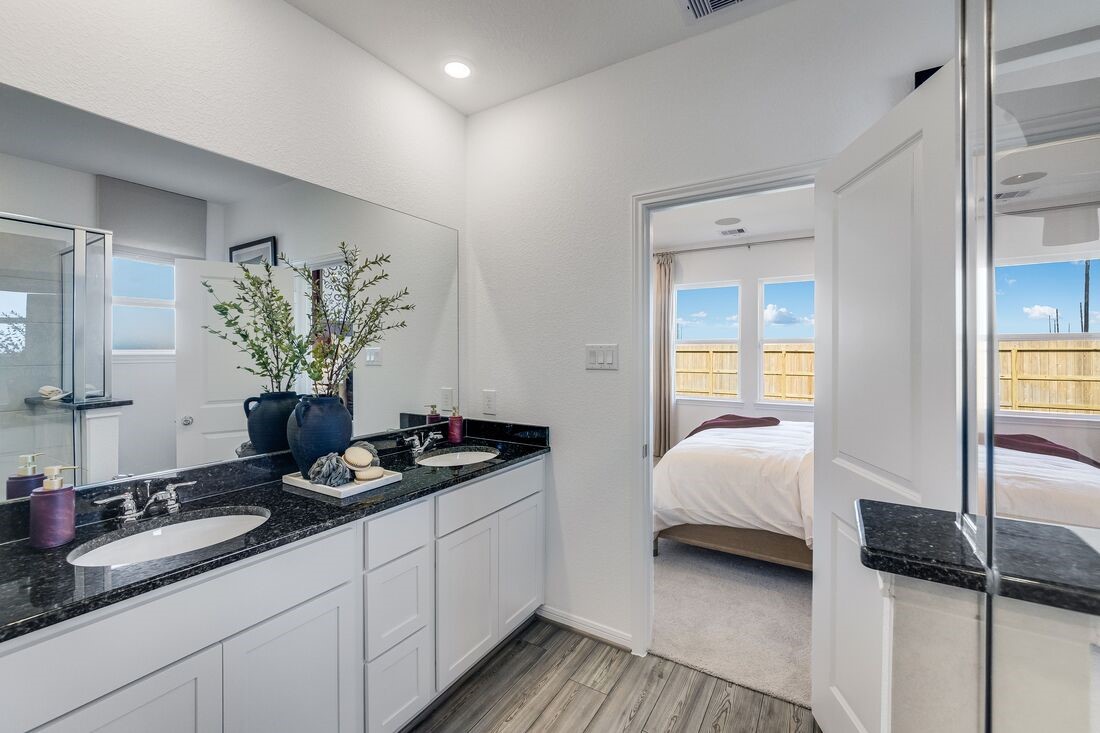 731 Willow Grove Lane Rosenberg, TX 77471 - Photo 13 of 23 a bedroom with a bed and a potted plant