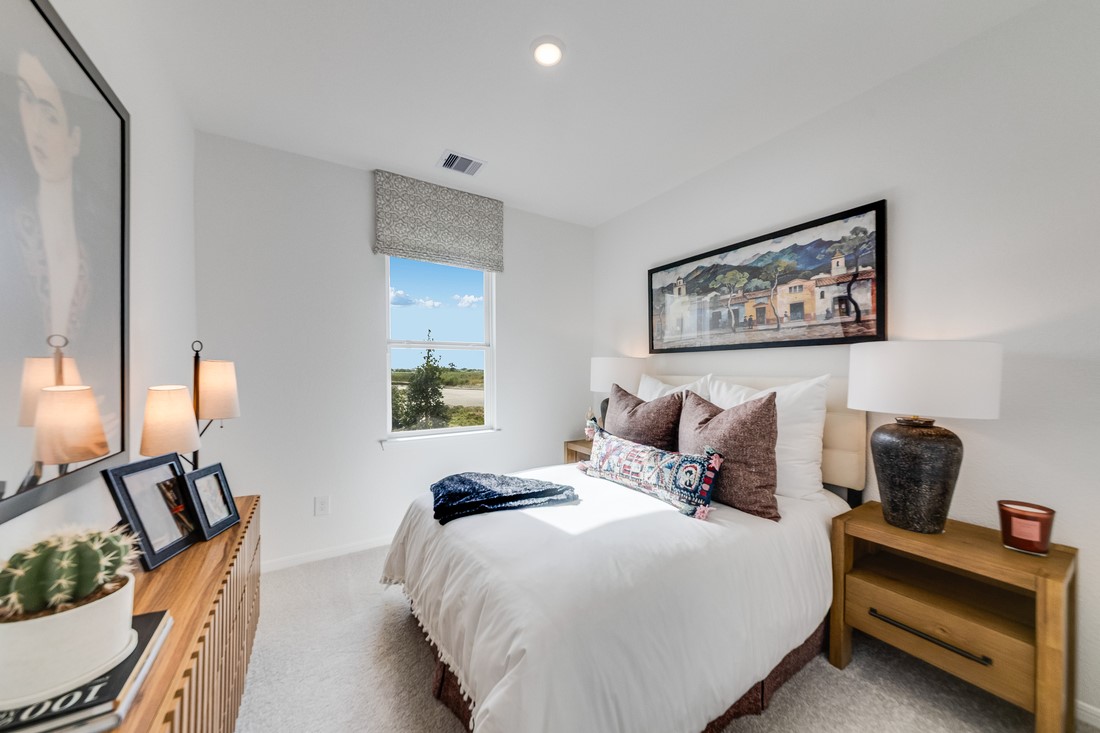 731 Willow Grove Lane Rosenberg, TX 77471 - Photo 15 of 23 a bedroom with a bed and wooden floor