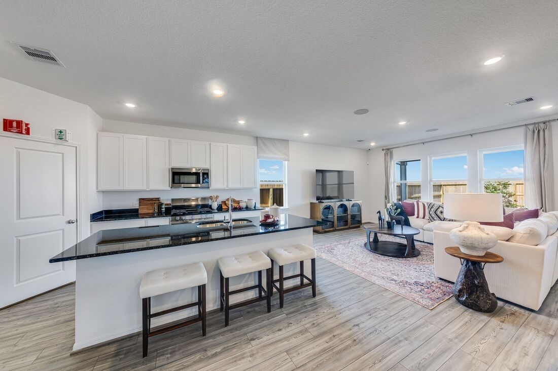 731 Willow Grove Lane Rosenberg, TX 77471 - Photo 7 of 23 a living room with stainless steel appliances furniture cabinets and wooden floor