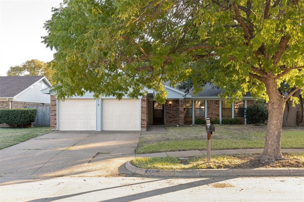 218 Juniper Drive Arlington, TX 76018 - Photo 1 of 1 a front view of a house with garden