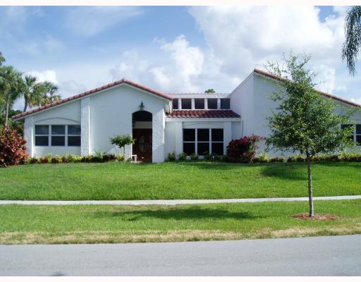 7149 Encina Lane Boca Raton, FL 33433 - Photo 1 of 22 a house view with a garden space